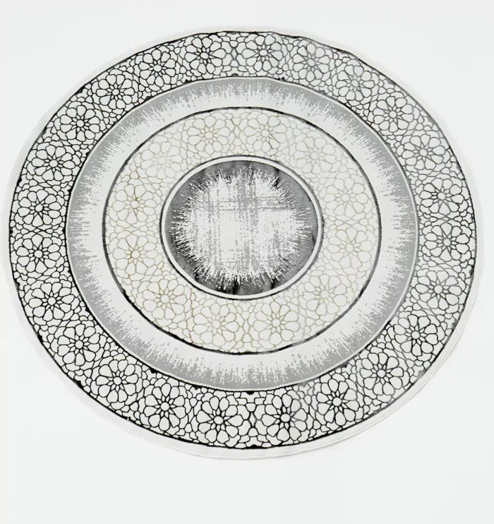 Durable machine-made rug with modern patterns, soft finish, and versatile design for home décor.
