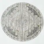 Durable machine-made rug with modern patterns, soft finish, and versatile design for home décor.