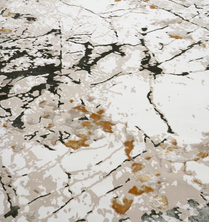 Durable machine-made rug with modern patterns, soft finish, and versatile design for home décor.