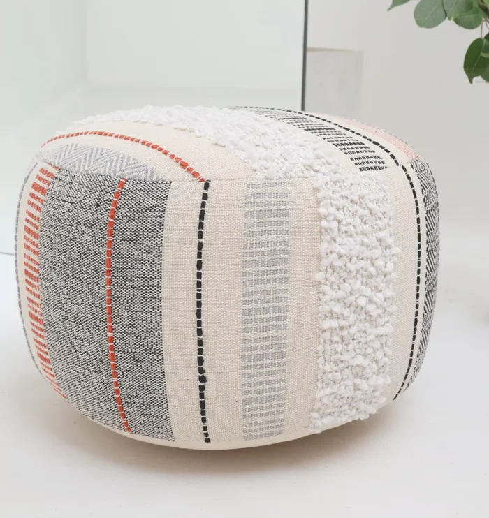 Decorative pouf for living room with stylish design, soft comfort, and versatile functionality.