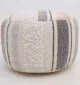 Decorative pouf for living room with stylish design, soft comfort, and versatile functionality.