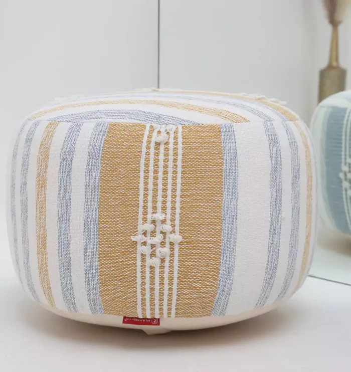 Decorative pouf for living room with stylish design, soft comfort, and versatile functionality.