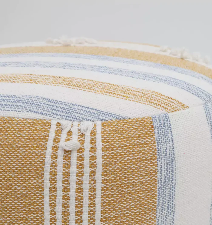 Decorative pouf for living room with stylish design, soft comfort, and versatile functionality.