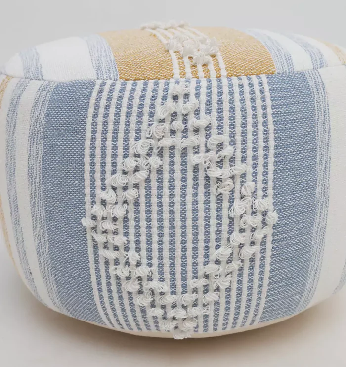 Decorative pouf for living room with stylish design, soft comfort, and versatile functionality.