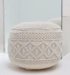 Decorative pouf for living room with stylish design, soft comfort, and versatile functionality.