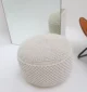 Decorative pouf for living room with stylish design, soft comfort, and versatile functionality.