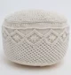 Decorative pouf for living room with stylish design, soft comfort, and versatile functionality.