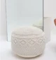 Decorative pouf for living room with stylish design, soft comfort, and versatile functionality.