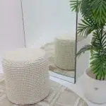 Decorative pouf for living room with stylish design, soft comfort, and versatile functionality.