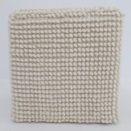 Decorative pouf for living room with stylish design, soft comfort, and versatile functionality.