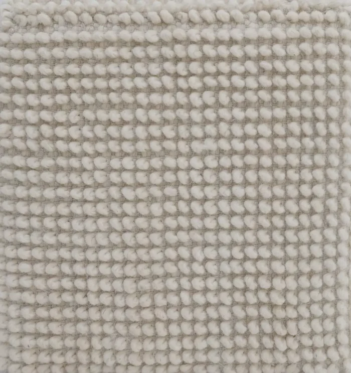 Decorative pouf for living room with stylish design, soft comfort, and versatile functionality.
