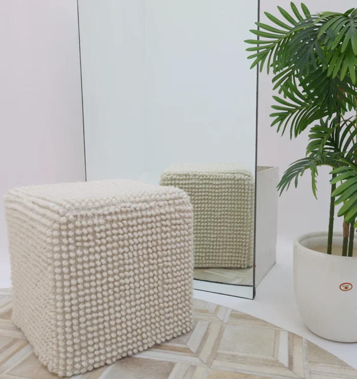 Decorative pouf for living room with stylish design, soft comfort, and versatile functionality.