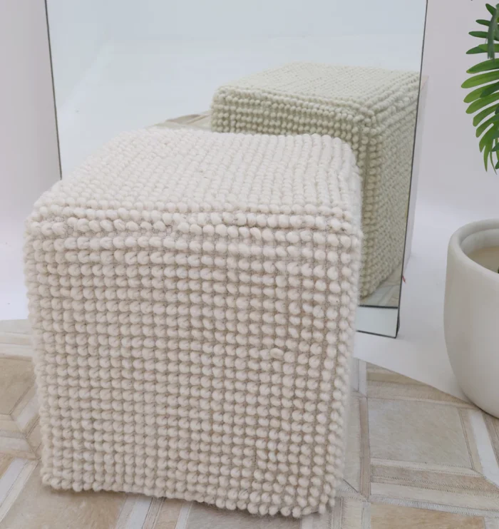 Decorative pouf for living room with stylish design, soft comfort, and versatile functionality.