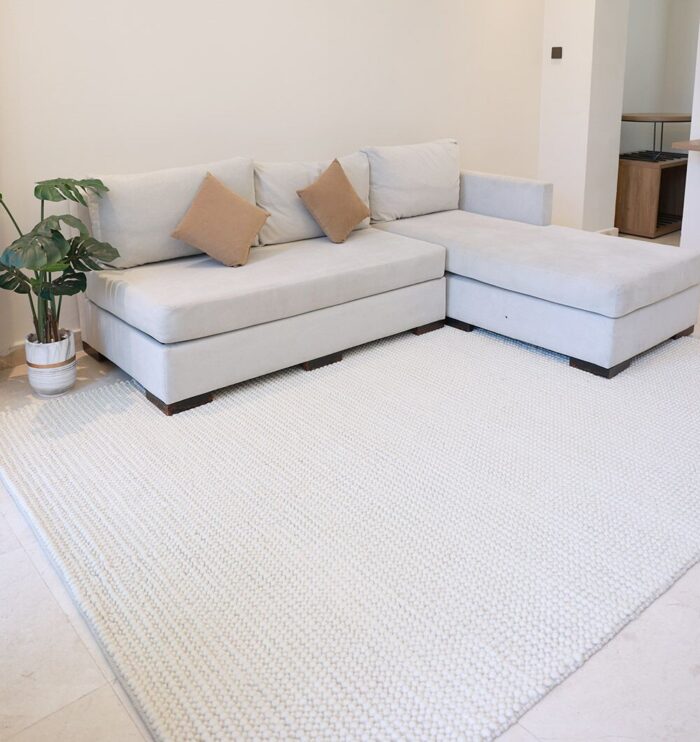 Bohemian hand woven wool rug from India, versatile indoor rug and hallway carpet for Dubai and UAE homes.