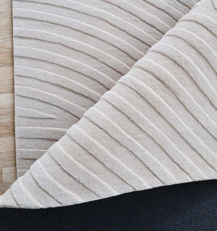 Stylish handmade rugs Dubai, featuring big living room rugs, modern tufted bedroom carpets, and elegant home rugs UAE.