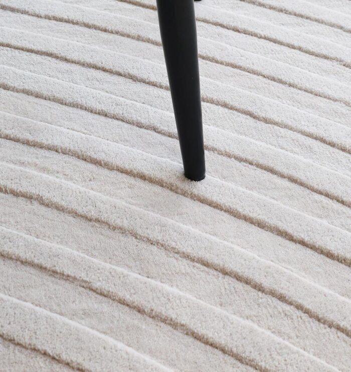 Stylish handmade rugs Dubai, featuring big living room rugs, modern tufted bedroom carpets, and elegant home rugs UAE.
