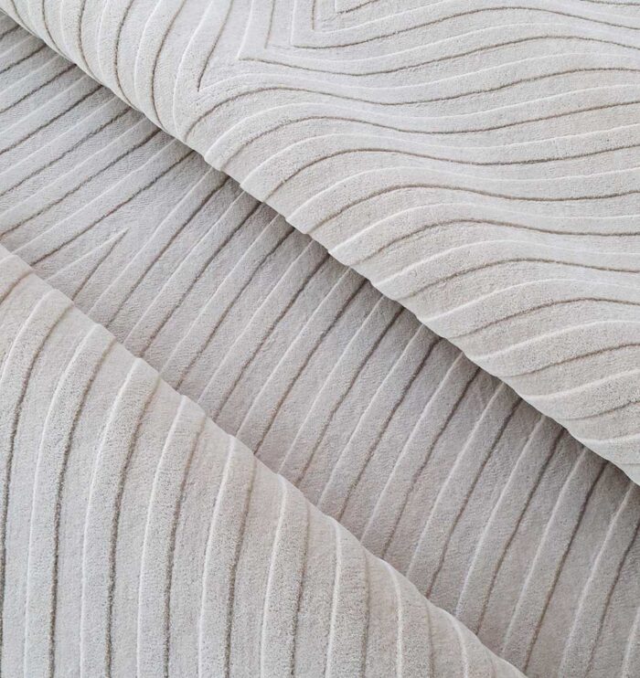 Stylish handmade rugs Dubai, featuring big living room rugs, modern tufted bedroom carpets, and elegant home rugs UAE.