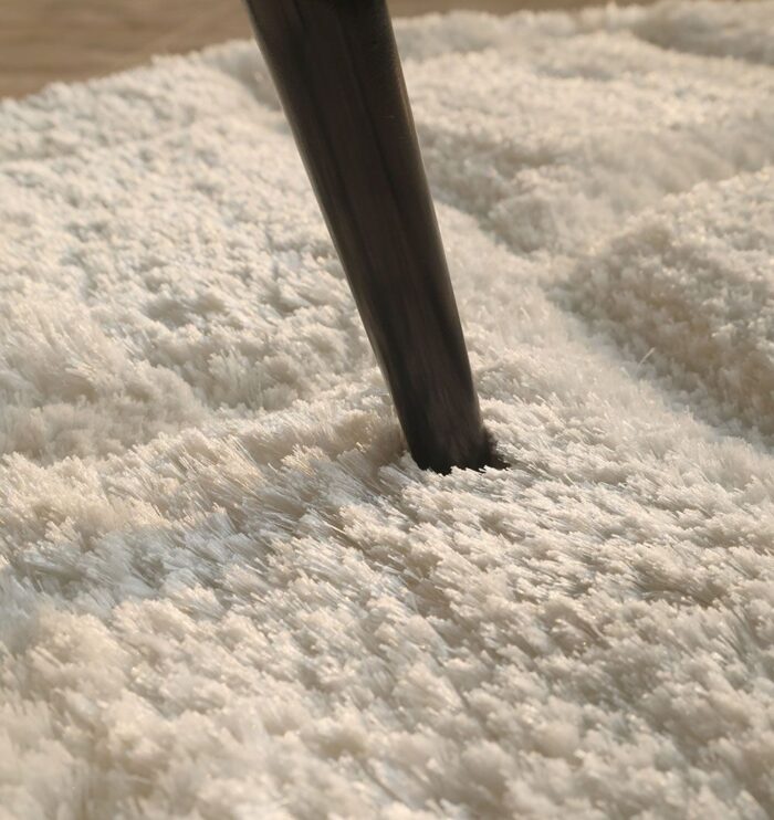 White round shaggy rug with soft plush texture, modern design, and cozy comfort for home décor.