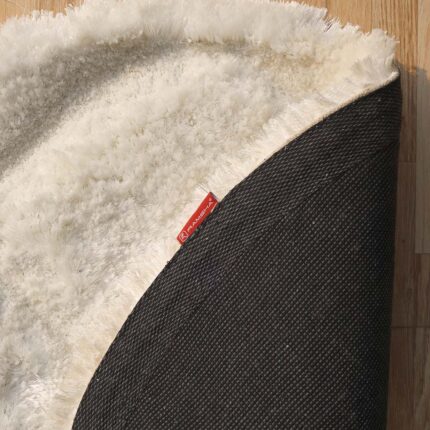 White round shaggy rug with soft plush texture, modern design, and cozy comfort for home décor.