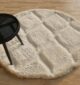 White round shaggy rug with soft plush texture, modern design, and cozy comfort for home décor.