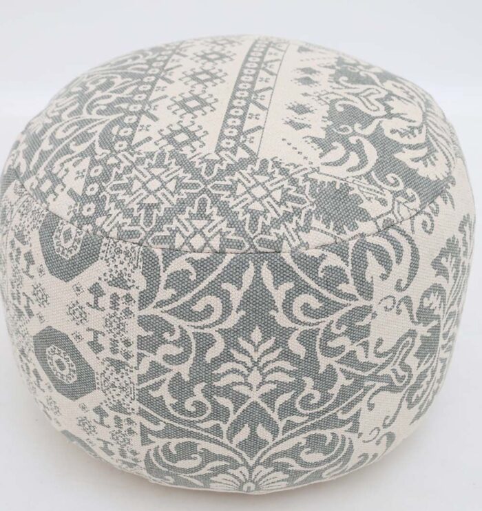 Elegant pouf seat and foot stool for modern homes in UAE, used as a stylish foot rest or extra seating.
