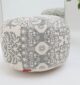 Elegant pouf seat and foot stool for modern homes in UAE, used as a stylish foot rest or extra seating.