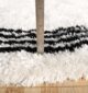 Luxurious plum fur rug with a soft shaggy texture, perfect as a living room carpet or bedroom rug in UAE homes.