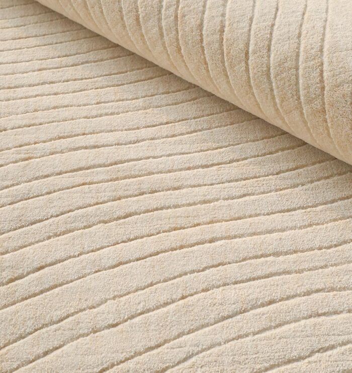 Natural handmade area rug crafted with premium materials, offering timeless style, warmth, and durability.