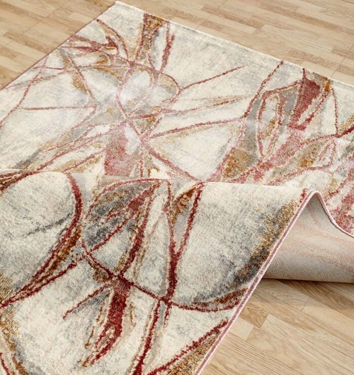 Machine-made rug with modern patterns, soft texture, and long-lasting durability for home décor.