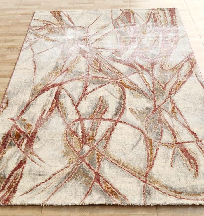 Machine-made rug with modern patterns, soft texture, and long-lasting durability for home décor.