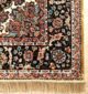Machine-made rug with modern patterns, soft texture, and long-lasting durability for home décor.