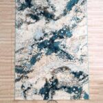 Machine-made rug featuring durable construction, stylish patterns, and easy-care design for modern homes.