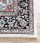 Upgrade your space with the durability and elegance of this machine-made rug.