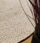Round jute carpet for living room and bedroom, designed in a modern carpet style to suit home décor in Dubai.