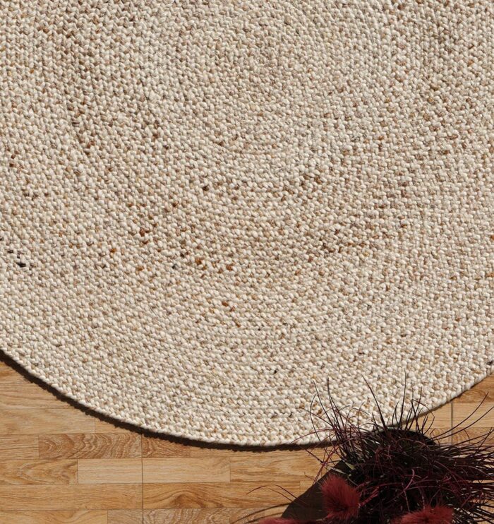 Round jute carpet for living room and bedroom, designed in a modern carpet style to suit home décor in Dubai.