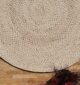 Round jute carpet for living room and bedroom, designed in a modern carpet style to suit home décor in Dubai.