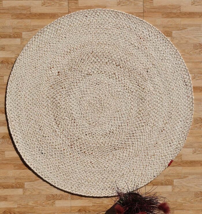 Round jute carpet for living room and bedroom, designed in a modern carpet style to suit home décor in Dubai.