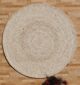 Round jute carpet for living room and bedroom, designed in a modern carpet style to suit home décor in Dubai.