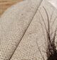 Round jute carpet for living room and bedroom, designed in a modern carpet style to suit home décor in Dubai.