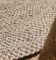 Round jute carpet for living room and bedroom, designed in a modern carpet style to suit home décor in Dubai.