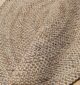 Round jute carpet for living room and bedroom, designed in a modern carpet style to suit home décor in Dubai.
