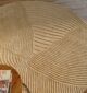 Round jute carpet for living room and bedroom, designed in a modern carpet style to suit home décor in Dubai.