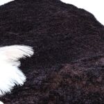 Handmade wool rug with soft white fur shag texture, adding warmth and luxury to living room or bedroom décor in Dubai and across UAE.