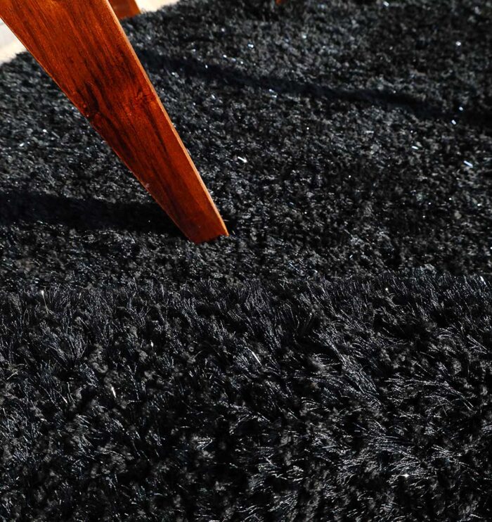 Handmade wool rug with soft white fur shag texture, adding warmth and luxury to living room or bedroom décor in Dubai and across UAE.