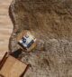 Handmade wool rug with soft white fur shag texture, adding warmth and luxury to living room or bedroom décor in Dubai and across UAE.