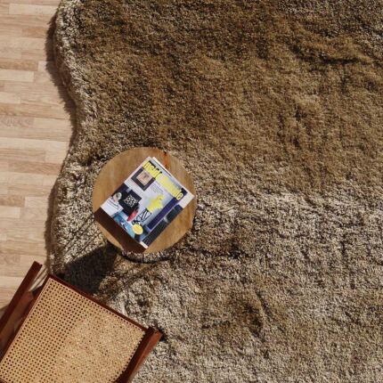 Handmade wool rug with soft white fur shag texture, adding warmth and luxury to living room or bedroom décor in Dubai and across UAE.