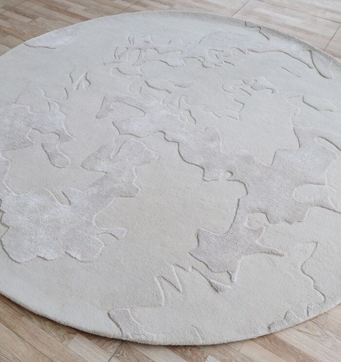 Elegant handmade circular carpet in Dubai, stylish tufted rug for living room and bedroom, available in UAE homes.