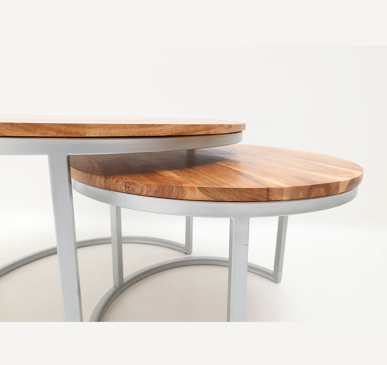 Angled Side View – Nesting Coffee Table Set of 2- GH-001 Angled side view of nesting coffee table set with wooden tops and sleek metal frames