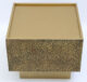Inclined top view of golden square iron side table with textured surface