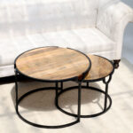 Angled top view of round wooden nesting coffee table with black metal frame GH-001